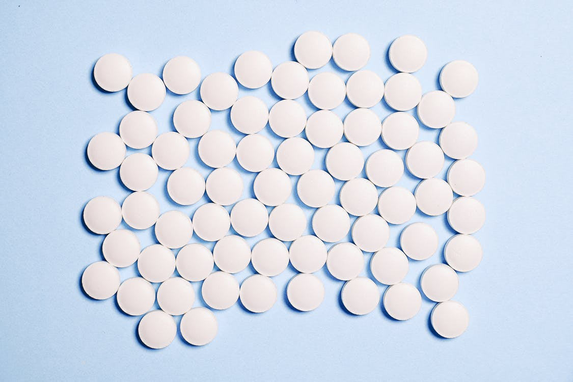 Affordable aspirin caplets placed on a surface