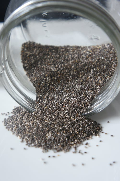 chia seeds falling out of a jar