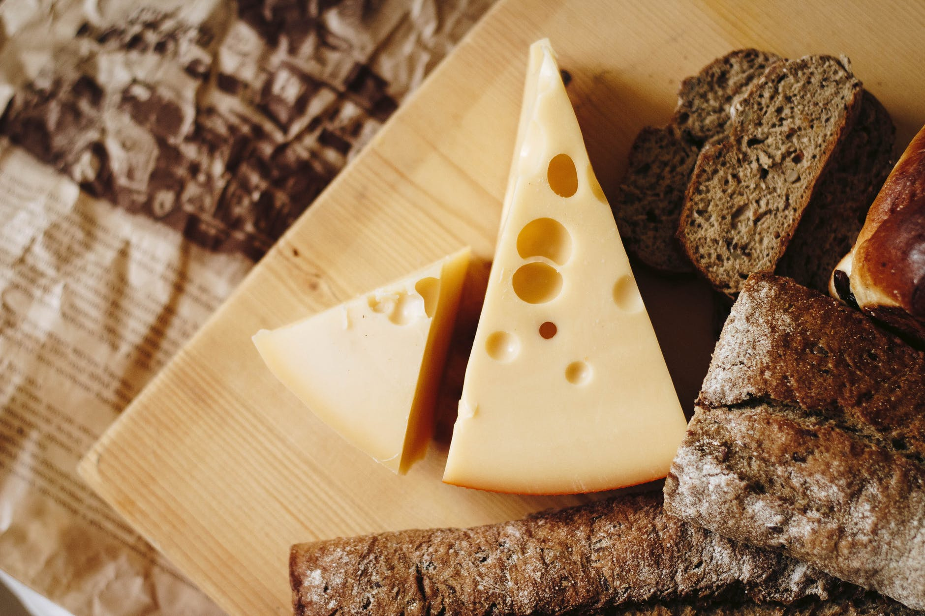  Cheese with bread on a board