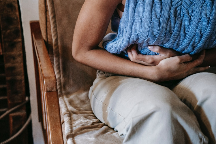 Woman suffering from stomach aches