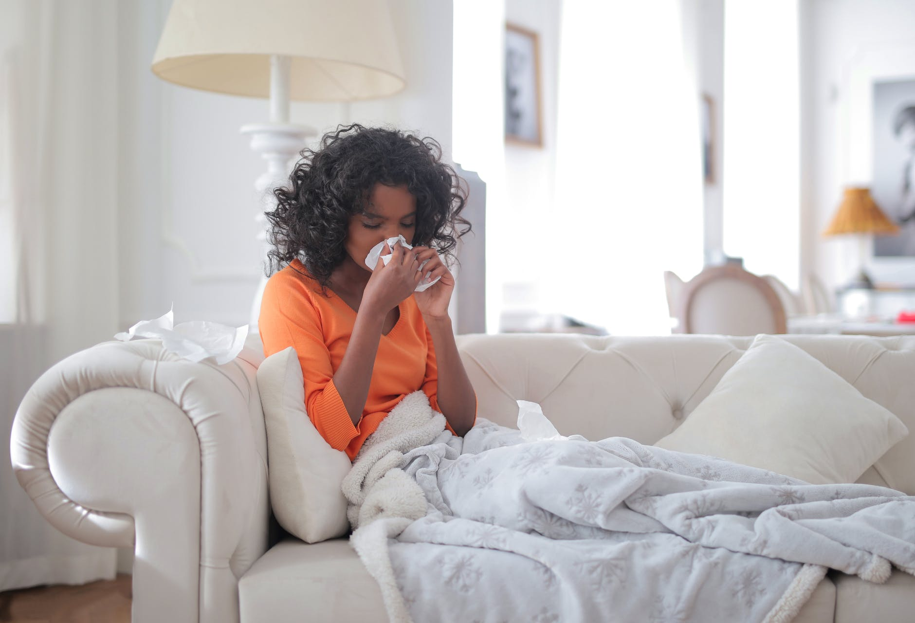 Woman blowing her nose